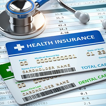 Health insurance card on top of dental insurance card